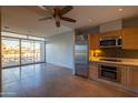 Modern kitchen with stainless steel appliances and wood cabinets at 4745 N Scottsdale Rd # 3013, Scottsdale, AZ 85251