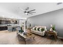 Bright living room with beige couch and decorative coffee table at 803 W Fairlane Ct, Casa Grande, AZ 85122