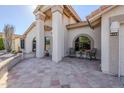 Front porch with tile flooring and seating area at 9455 W Behrend Dr, Peoria, AZ 85382