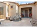 Inviting courtyard entry with a stone water feature at 16938 W Desert Rose Ln, Surprise, AZ 85387