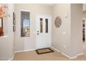 Bright and airy entryway with tile flooring at 16938 W Desert Rose Ln, Surprise, AZ 85387
