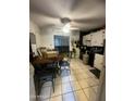 Kitchen with dining area and view into the living room at 2417 E Mobile Ln, Phoenix, AZ 85040