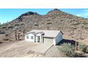 Newly built home with desert landscape and mountain backdrop at 27112 N 148Th Dr, Surprise, AZ 85387