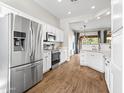 Modern kitchen with stainless steel appliances and white cabinets at 3402 W Zuni Brave Trl, Phoenix, AZ 85086