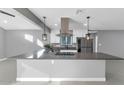 Modern kitchen with stainless steel appliances and an island at 4345 E Desert Cactus St, Phoenix, AZ 85032