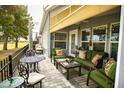 Covered patio with comfortable seating area and golf course view at 650 N Hawes Rd # 2840, Mesa, AZ 85207