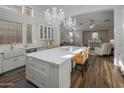 Spacious kitchen featuring white cabinets, a large island, and stainless steel appliances at 8054 S Stephanie Ln, Tempe, AZ 85284