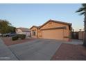 House exterior showcasing a two-car garage and driveway at 15535 N 159Th Ln, Surprise, AZ 85374