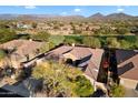 Aerial view of house and surrounding golf course community at 1572 W Laurel Greens Dr, Anthem, AZ 85086