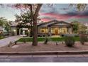 Craftsman style home with stone accents and a welcoming front porch at 18884 N 98Th St, Scottsdale, AZ 85255