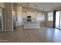 Modern kitchen with stainless steel appliances and an island at 34838 N 3Rd Ave, Phoenix, AZ 85086