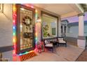 Cozy front porch with seating area and holiday decor at 4216 E Oxford Ln, Gilbert, AZ 85295