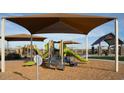 Community playground with shade structures and play equipment at 4514 E French Rd, San Tan Valley, AZ 85143