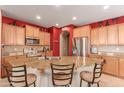 Kitchen island with granite countertops and stainless steel appliances at 12006 W Vernon Ave, Avondale, AZ 85392