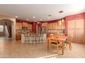 Eat-in kitchen with island, ample cabinetry, and stainless steel appliances at 12006 W Vernon Ave, Avondale, AZ 85392