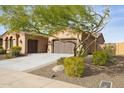 Two-story house with a two car garage and desert landscaping at 12860 W Calle De Sol --, Peoria, AZ 85383