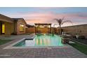 Resort-style backyard with a large pool and pergola at 12860 W Calle De Sol --, Peoria, AZ 85383