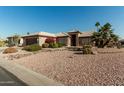 House exterior showcasing desert landscaping and a two-car garage at 15773 W La Reata Ave, Goodyear, AZ 85395