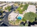 Community pool and surrounding buildings in an aerial view at 1716 W Cortez St # 116, Phoenix, AZ 85029