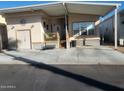 Front view of manufactured home with covered porch at 17200 W Bell Rd # 1015, Surprise, AZ 85374