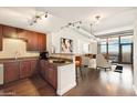 Modern kitchen with dark wood cabinets and granite countertops at 310 S 4Th St # 2002, Phoenix, AZ 85004