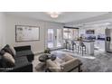 Virtually staged kitchen and living area with modern appliances and island at 4336 N Parkway Ave, Scottsdale, AZ 85251