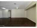 Living room with dark tile floors and ceiling fan at 45142 W Windrose Dr, Maricopa, AZ 85139