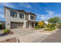 Two-story home with neutral siding, shutters, and landscaping at 4758 S Pluto --, Mesa, AZ 85212