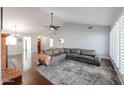 Bright living room featuring hardwood floors and a cozy fireplace at 5820 W Morelos St, Chandler, AZ 85226