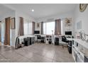 Bright home office with ample workspace and built-in shelving at 16406 W Charlotte Dr, Surprise, AZ 85387