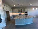 Spacious kitchen with large island, granite countertops, and light gray cabinets at 3290 W San Cristobal Rd, San Tan Valley, AZ 85144