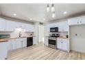 Remodeled kitchen featuring white shaker cabinets, butcher block countertops, and stainless steel appliances at 3350 W Wethersfield Rd, Phoenix, AZ 85029