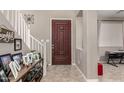 Entryway with staircase, tile flooring and decorative accents at 6260 S Fresno St, Chandler, AZ 85249