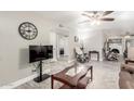 Open living room showcasing a view into other rooms and a fireplace at 2255 W Osage Ave, Mesa, AZ 85202