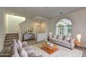 Bright and airy living room with comfortable seating and a large window at 2550 N 149Th Ave, Goodyear, AZ 85395