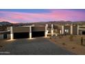 Modern home exterior featuring a two-car garage and beautiful desert landscaping at 256 E Tumbleweed Dr, Phoenix, AZ 85085