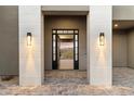 Open front door revealing a view and inviting entryway with modern light fixtures at 256 E Tumbleweed Dr, Phoenix, AZ 85085