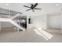 Bright and airy living room with tile floors and staircase at 5037 N 83Rd St, Scottsdale, AZ 85250