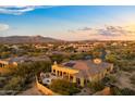 Aerial view showcasing the home's backyard oasis, mountain views, and surrounding community at 10737 E Scopa Trl, Scottsdale, AZ 85262