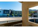View from condo balcony showcases nearby buildings and mountains at 1401 E Puget Ave # 24, Phoenix, AZ 85020