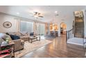 Spacious living room featuring hardwood floors and an open floor plan at 29381 N 123Rd Ave, Peoria, AZ 85383