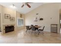 Bright dining area with a wooden table and four chairs, near a fireplace at 4113 W Bart Dr, Chandler, AZ 85226