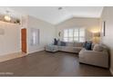 Spacious living room featuring a sectional sofa and wood-look floors at 4113 W Bart Dr, Chandler, AZ 85226