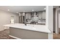 Renovated kitchen with white countertops and gray cabinets at 6816 E Oak St, Scottsdale, AZ 85257