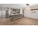 Updated kitchen featuring stainless steel appliances and an island at 6816 E Oak St, Scottsdale, AZ 85257