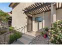 Front entrance with pergola and landscaping at 10631 N 15Th Way # 14, Phoenix, AZ 85020