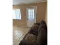 Living room features tile floors and a couch at 141 E Kesler Ln, Chandler, AZ 85225