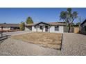 Updated home with a clean, modern exterior and landscaping at 1436 E Downing St, Mesa, AZ 85203