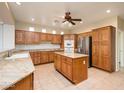 Spacious kitchen with island, granite countertops, and wood cabinets at 2737 N 160Th Ave, Goodyear, AZ 85395