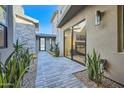Private courtyard with stone path and desert landscaping at 37200 N Cave Creek Rd # 1119, Scottsdale, AZ 85262